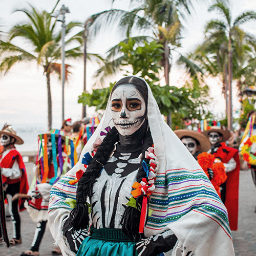 Beautiful Catrinas and pan de muerto, two icons of The Day of the Dead